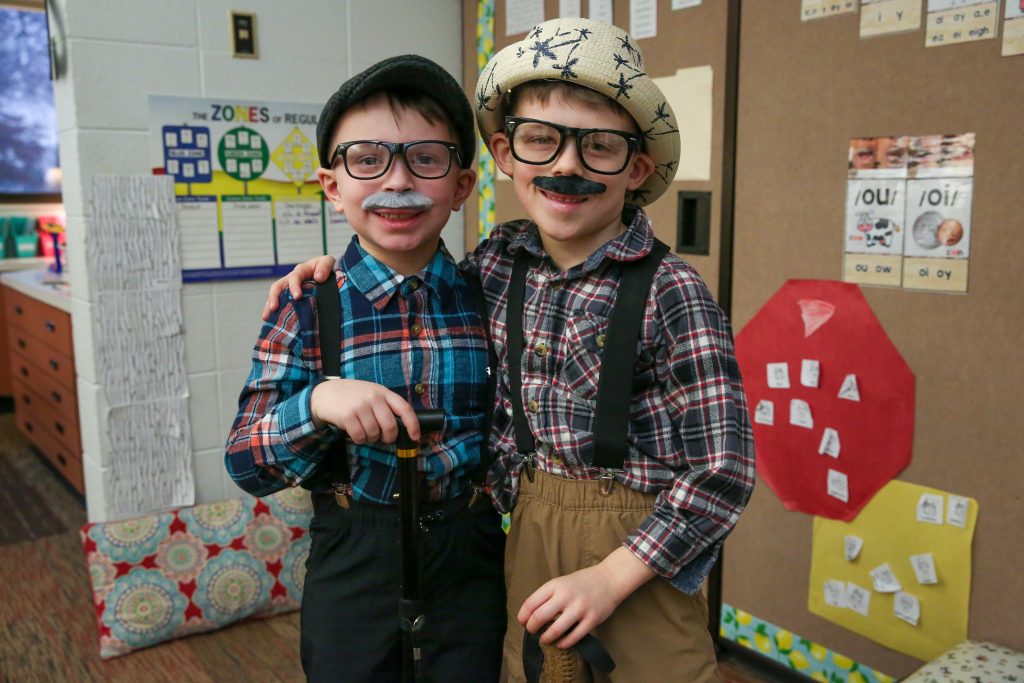 Two students dressed as 100 year olds