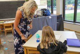 teacher helping student