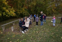 Students learning outside on the prairie