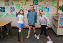 Students posing smiling at the camera.
