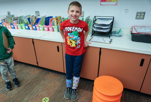 Smiling boy in classroom