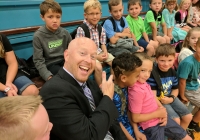 Madison Principal Kevin McMillen admires student's 1st Day of School haircut