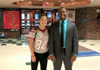 Grissom Principal Jean Milfort with Grissom's female football player linebacker and tight end